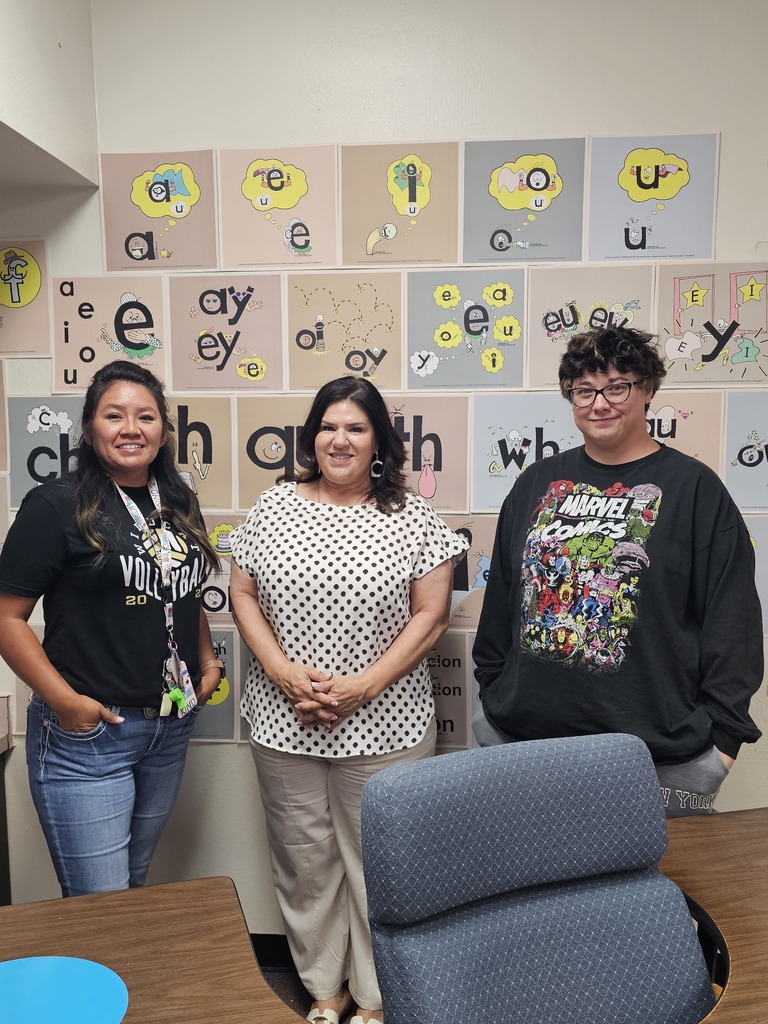 Three teachers in a classroom