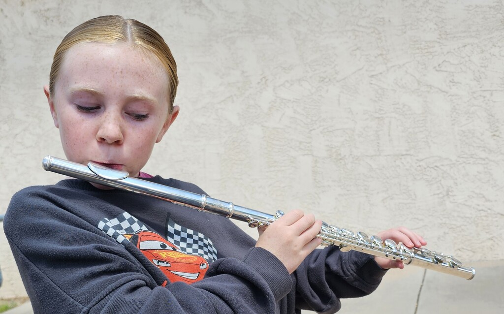 girl playing flute