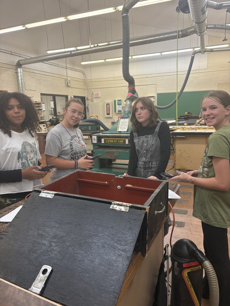 Students find the volume of a box and determine how much it will cost to fill it with potting soil.