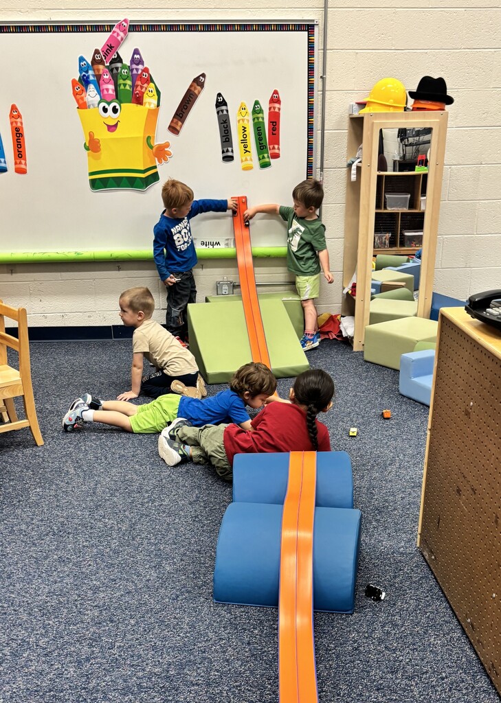 Children playing, sharing and taking turns.