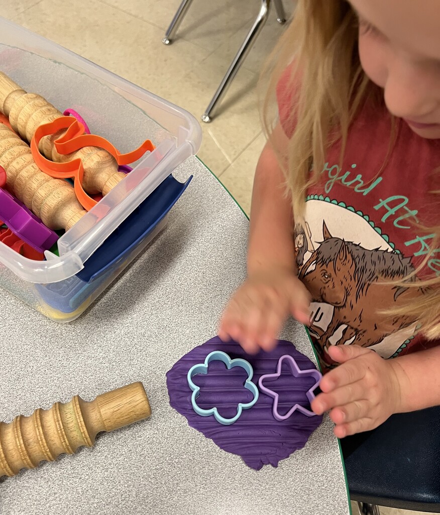 Play dough develops finger strength.