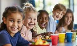 Happy kids eating school lunch