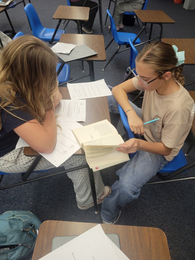 Students look for evidence in their books.