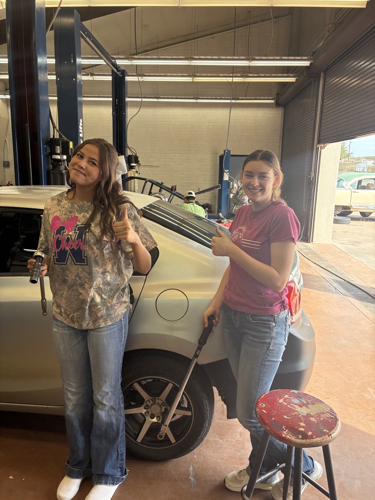 Reese and Jackie Torquing the wheels.
