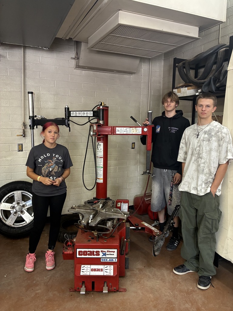 JD Brolan and Kashlie with the tire machine