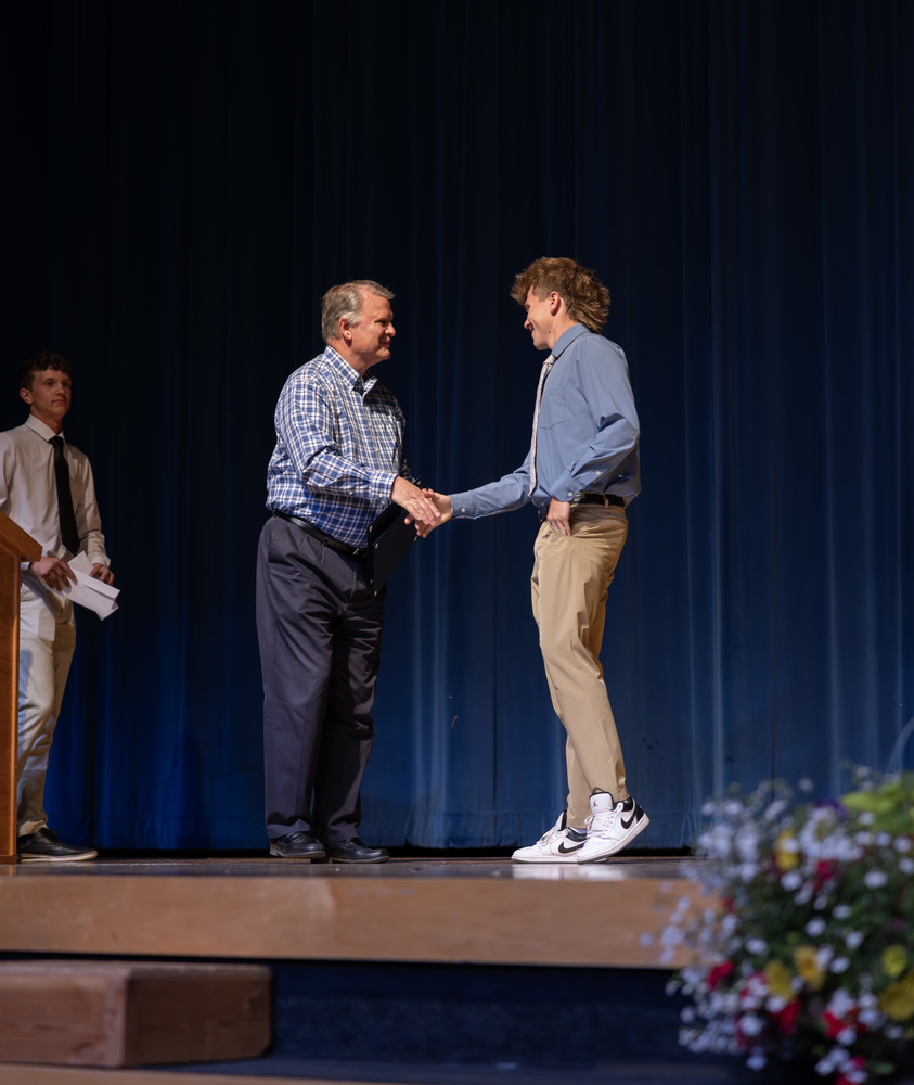 Brent Davis presents scholarship award to Dawson Ludlow