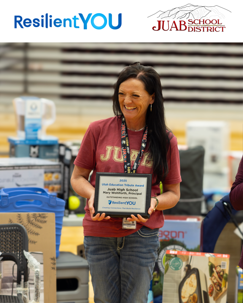 Principal Wohlforth accepting the ResilientYOU Award for the Most Outstanding High School