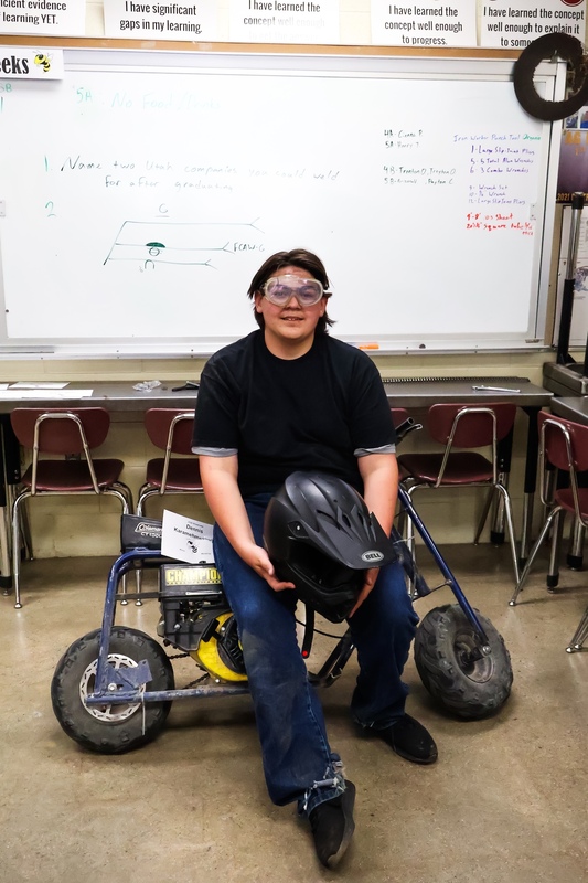 Dennis Karamehmetoglu stands with his modified Tote Goat project at the Juab High CTE Showcase.