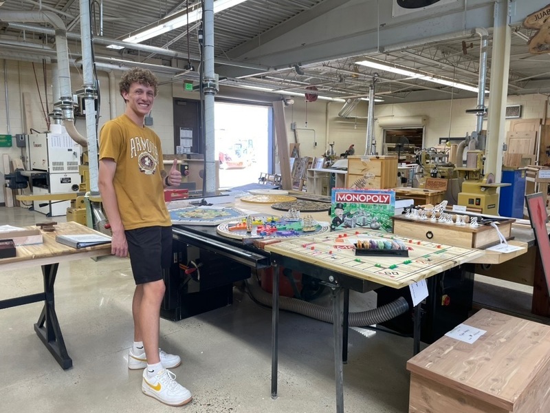 Logan Crippen showcases handcrafted game boards inspired by Monopoly, Catan, and Risk, projects that combined woodworking, design, and 3D printing.