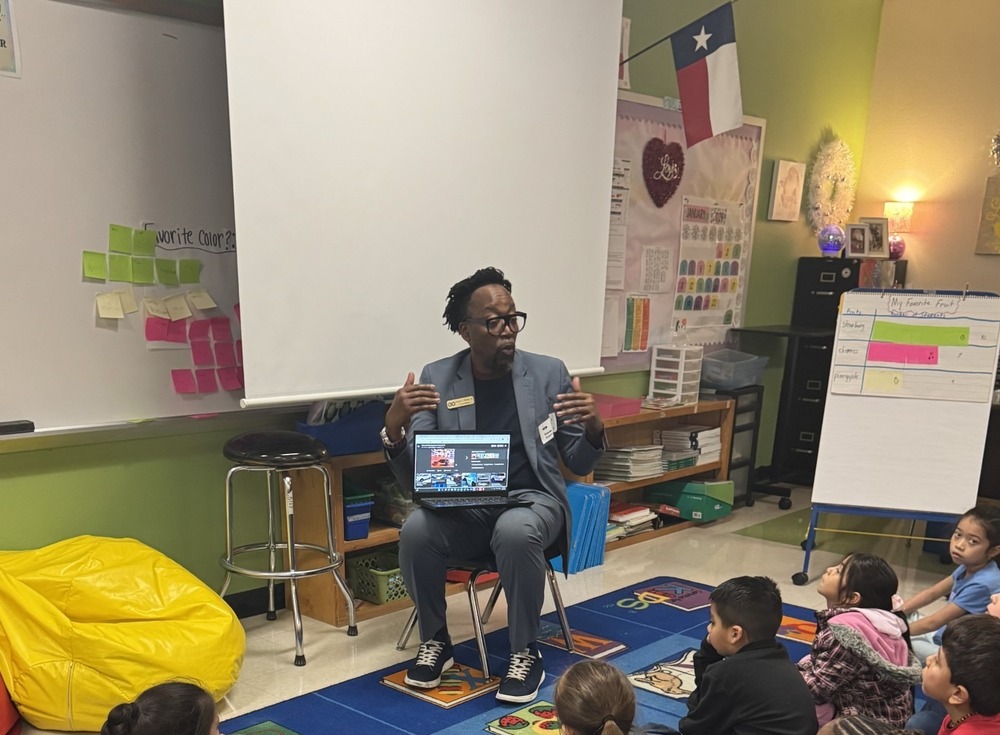 volunteer talking to students