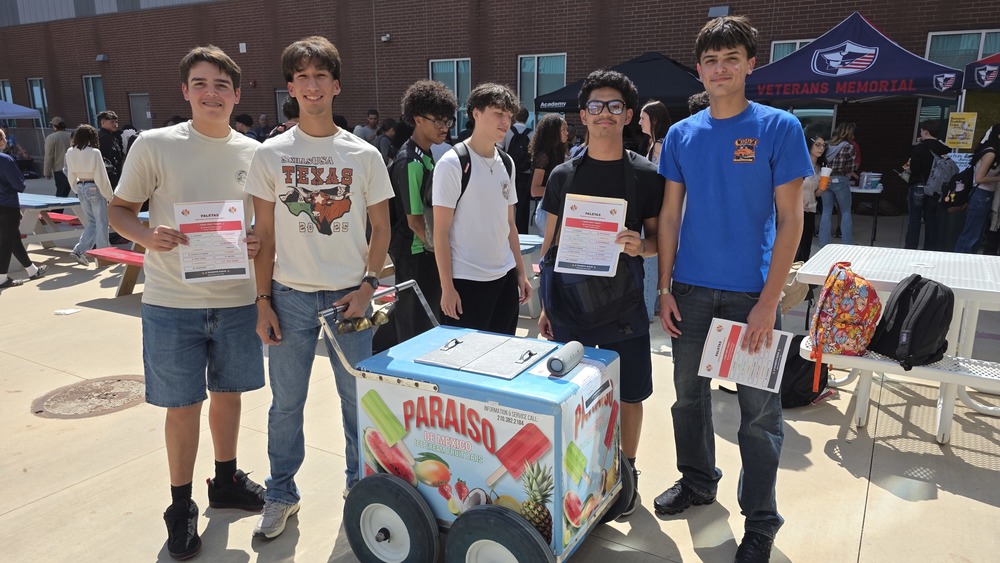 four students posing with their paleta cart during food fest