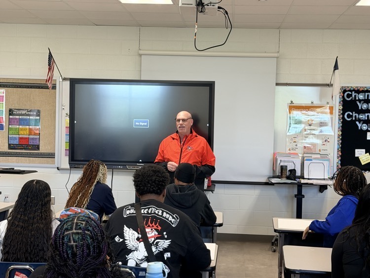 Mr. Reeve engaging scholars in a team activity