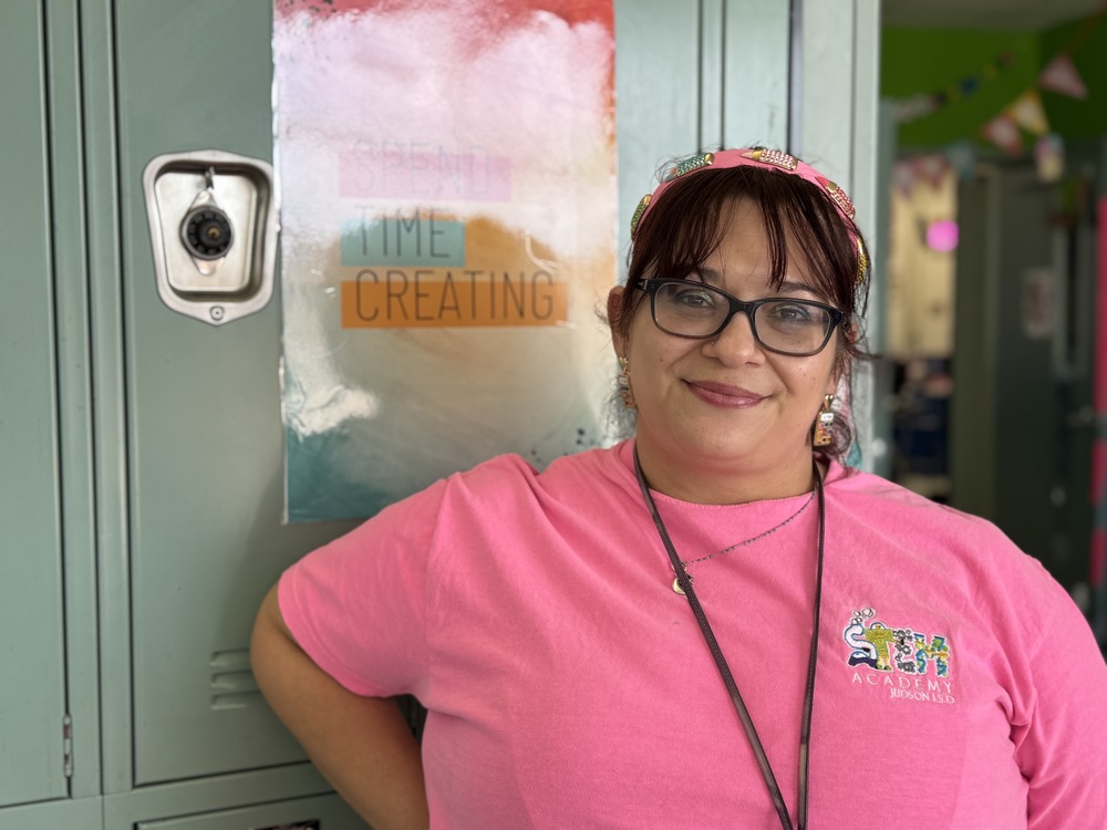 Woman in pink JSTEM shirt