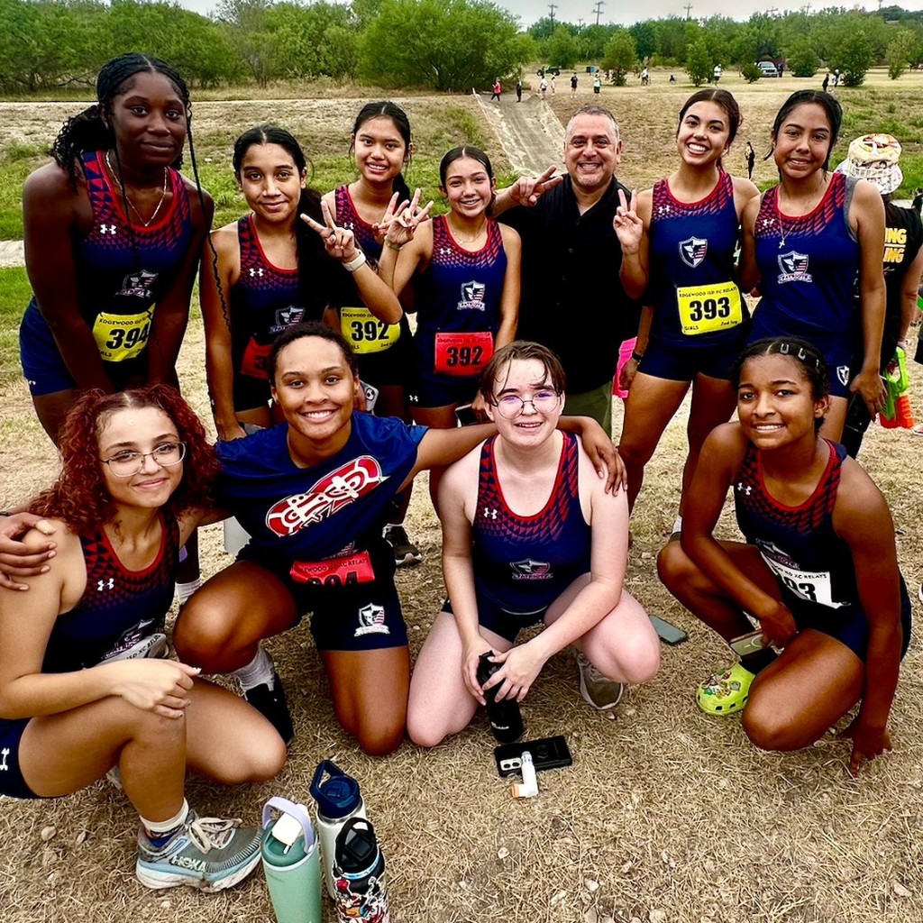 XC runners posing with Dr. Diaz