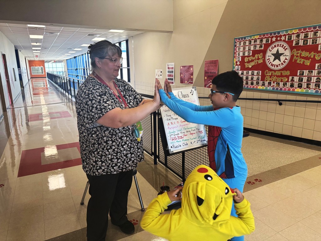 teacher giving a student a high five