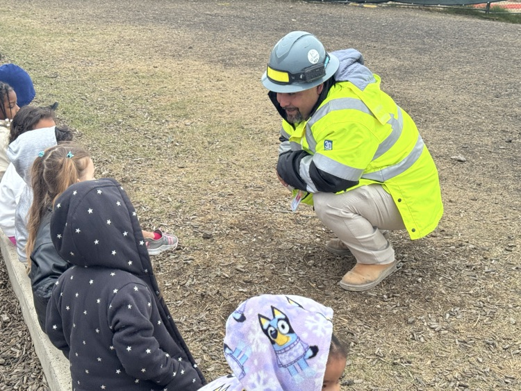man listening to children