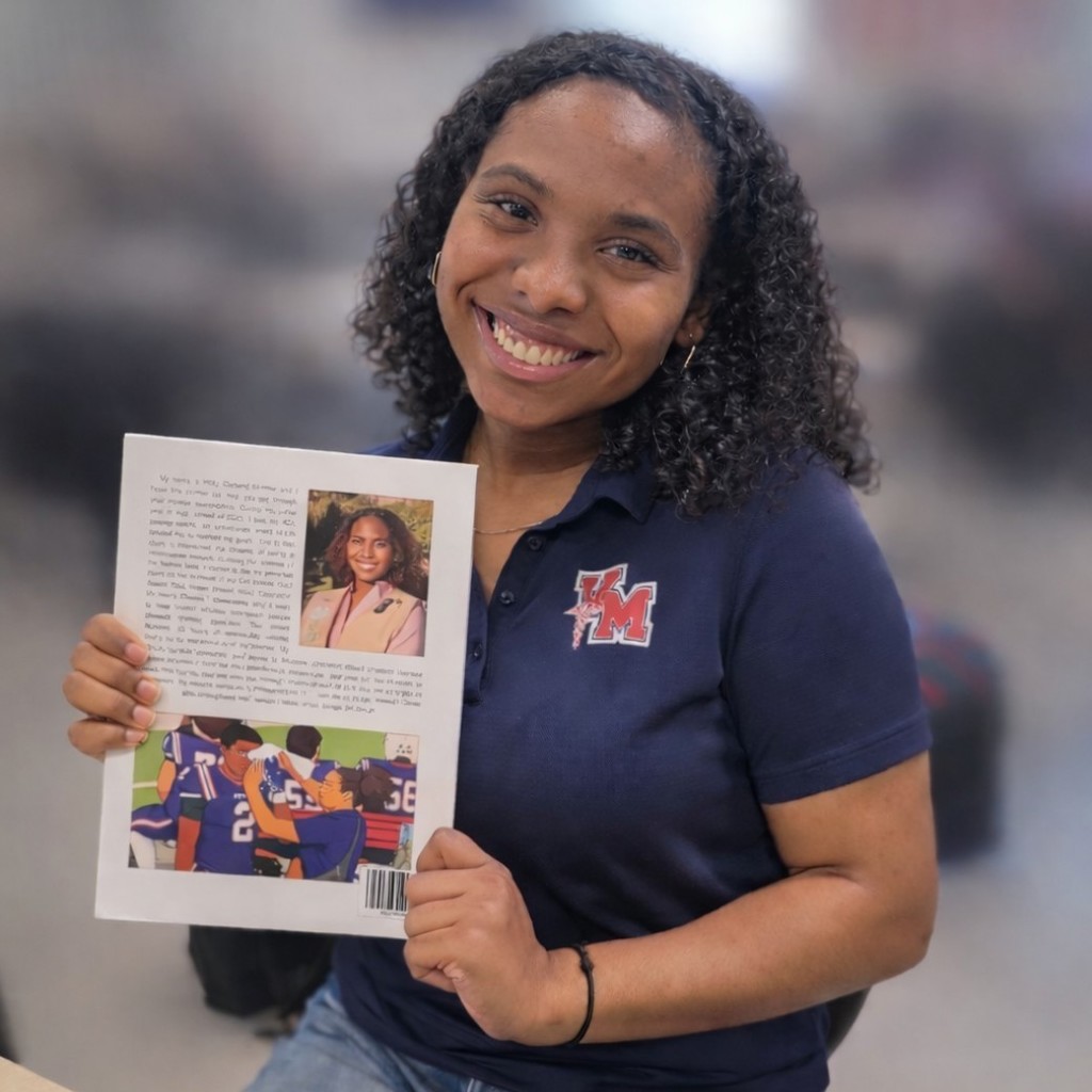 Holly holding her publication so we can see the back cover