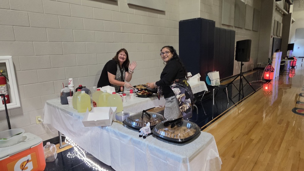 Student and staff enjoying Chick-fil-a catering at the Essential Academics prom at VMHS