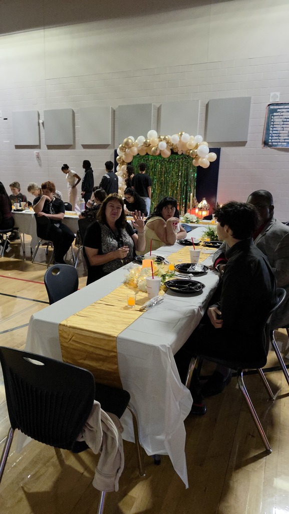Staff and students enjoying the Chick-fil-a meal during the Essential Academics prom at VMHS