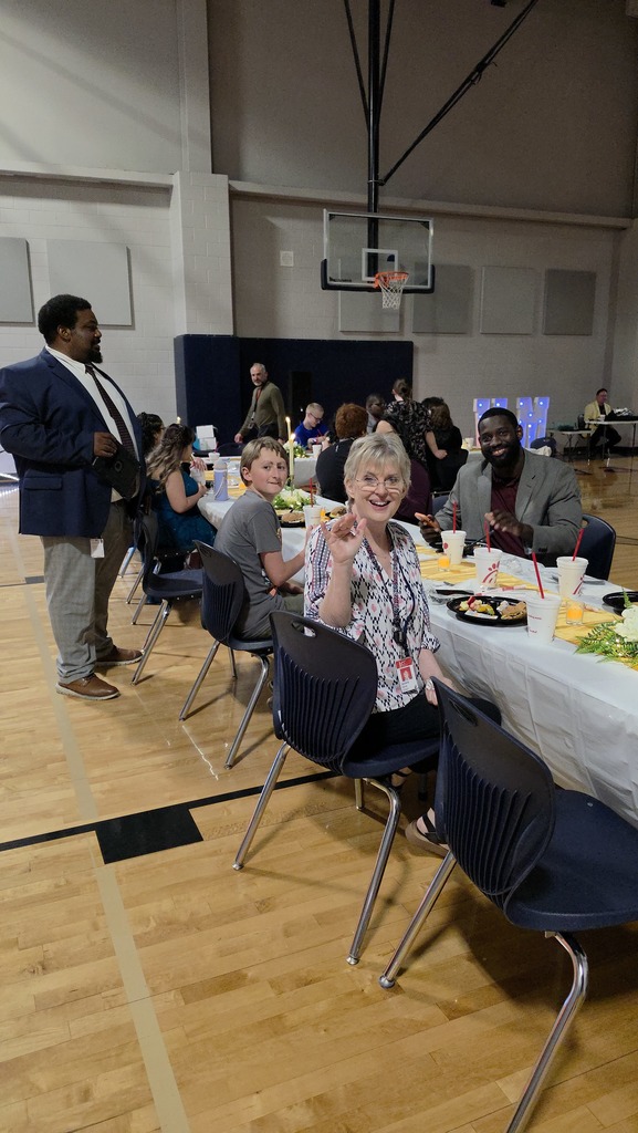 Staff and students enjoying the Chick-fil-a meal during the Essential Academics prom at VMHS