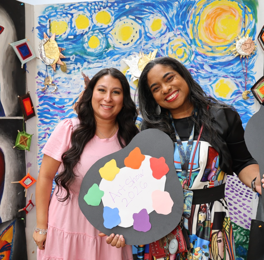 Teachers in front of art