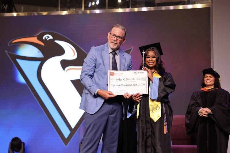 Dr. Mike Gustin SYF President presents Iyla her $18K scholarship 