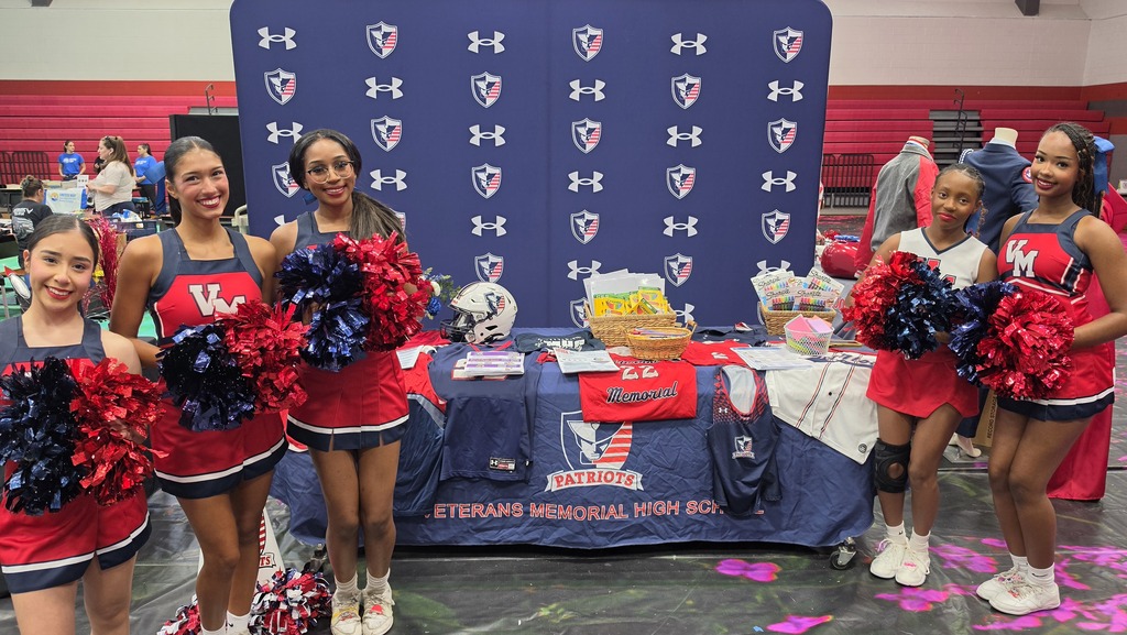 Photo of the Veterans Memorial High School booth at the Judson ISD Back-to-School Block Party, featuring Patriot gear, school information, and VMHS cheerleaders