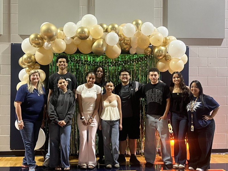 Principal Dr. Arredondo, sponsor Mrs. Laura Guerra, and PALS students pose in front of the balloon arch during the Unified Prom at VMHS