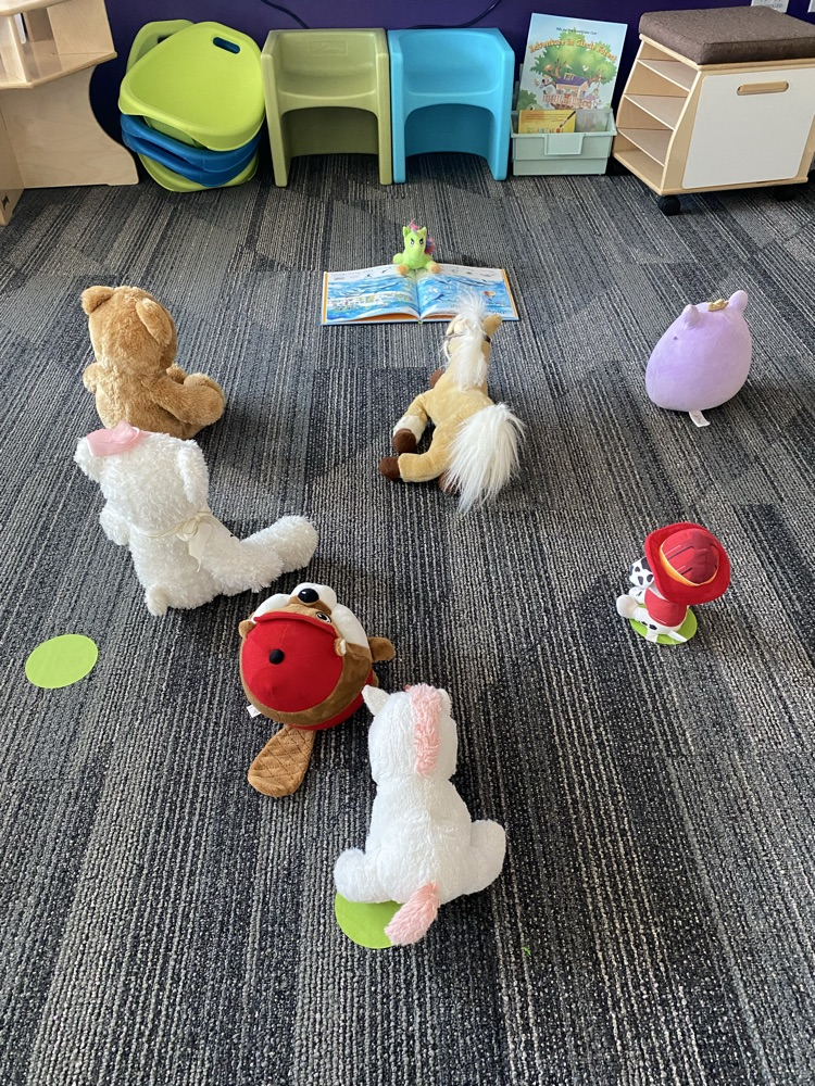 stuffies reading a book
