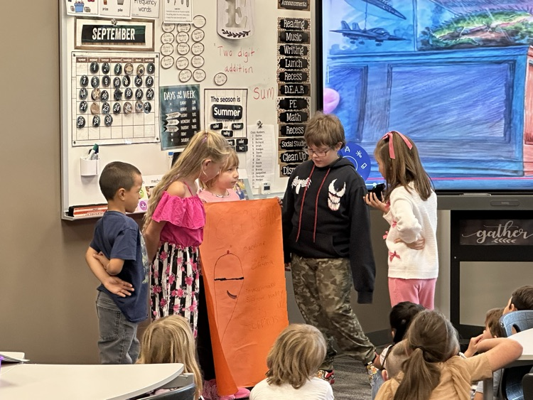 Presenting their posters.