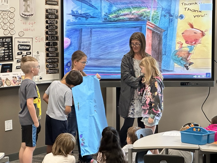 Presenting their posters.