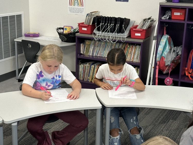 Working with partners to find their spelling words