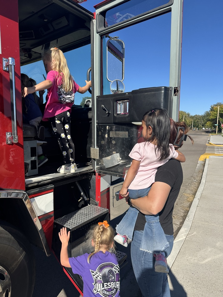 students exploring the fire truck