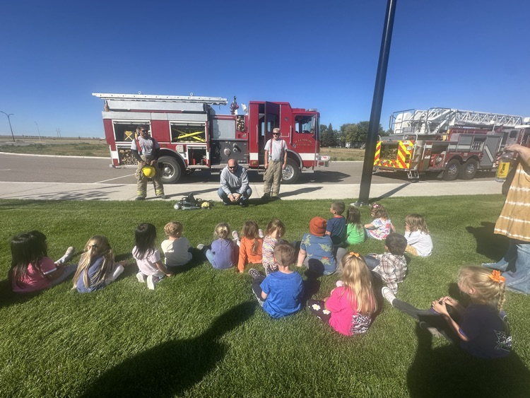 students listening to fire department presentation