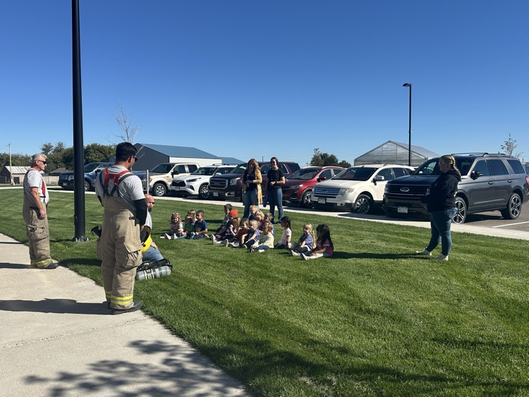 students listening to fire department presentation