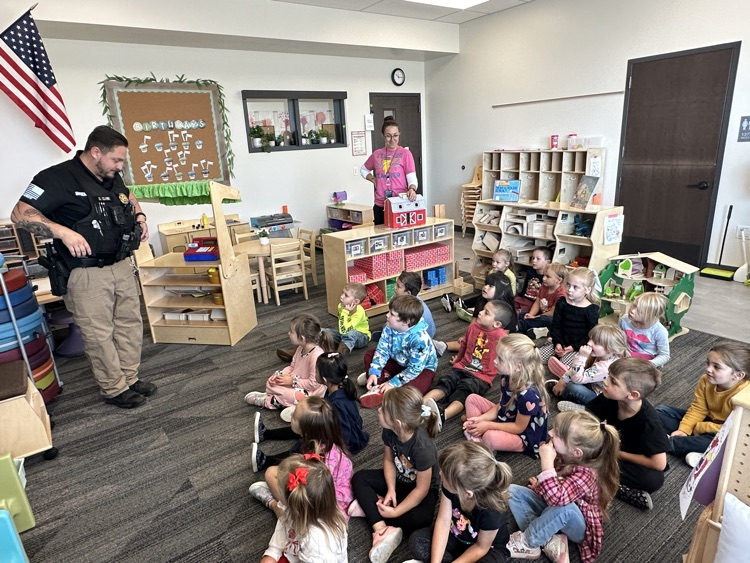 Students listening to law enforcement presentation from Deputy Clark