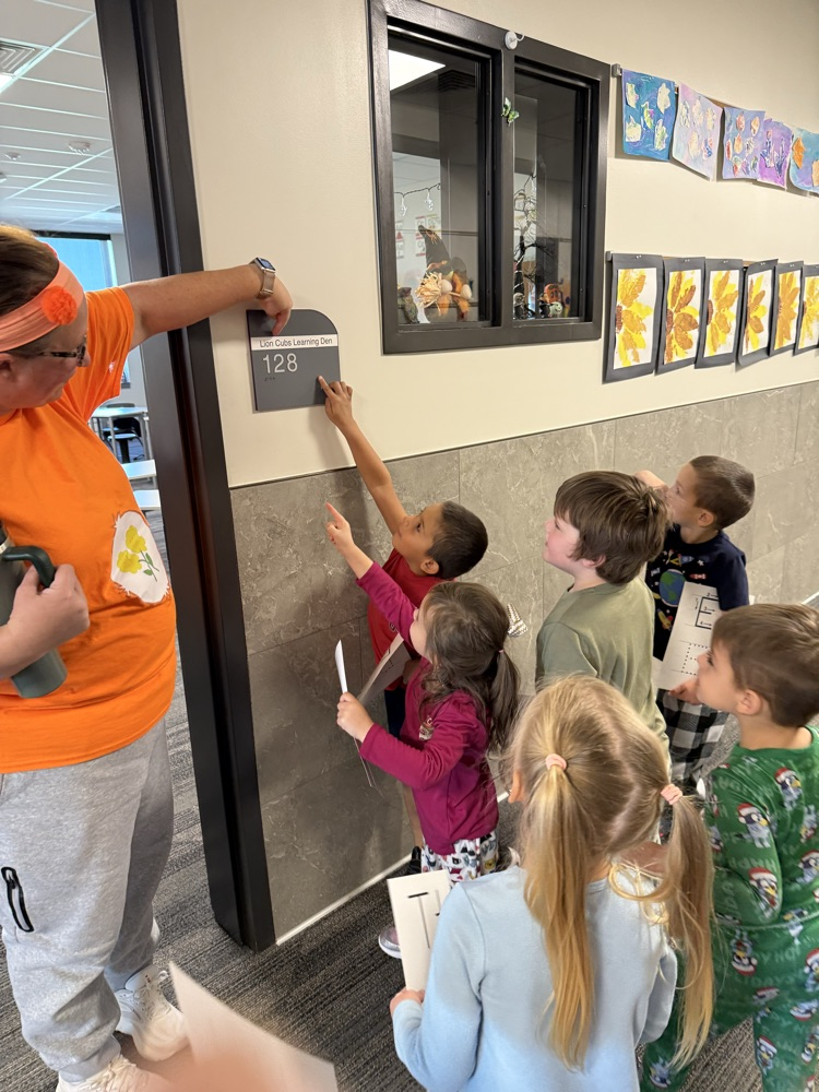students locating their given letter on signs throughout the school hallways