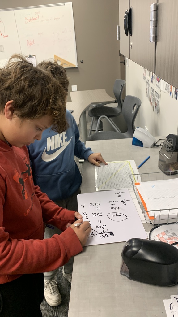 Here we can see a student walking another student through their work