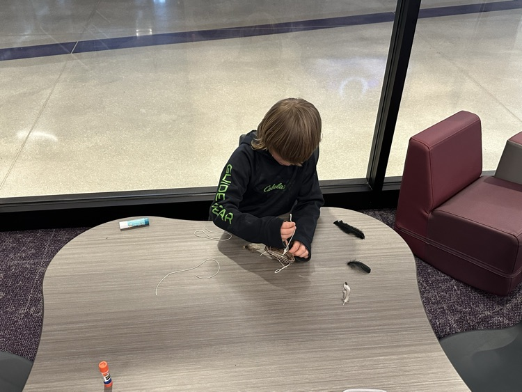 Buddy classes working together to make dream catchers