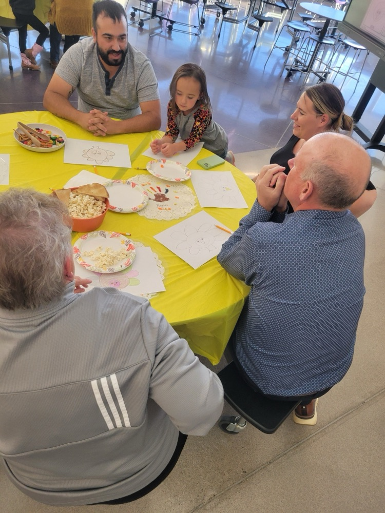 students and families celebrating a Charlie Brown style  Thanksgiving 