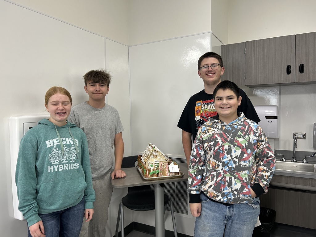Gingerbread house with a pretzel fence