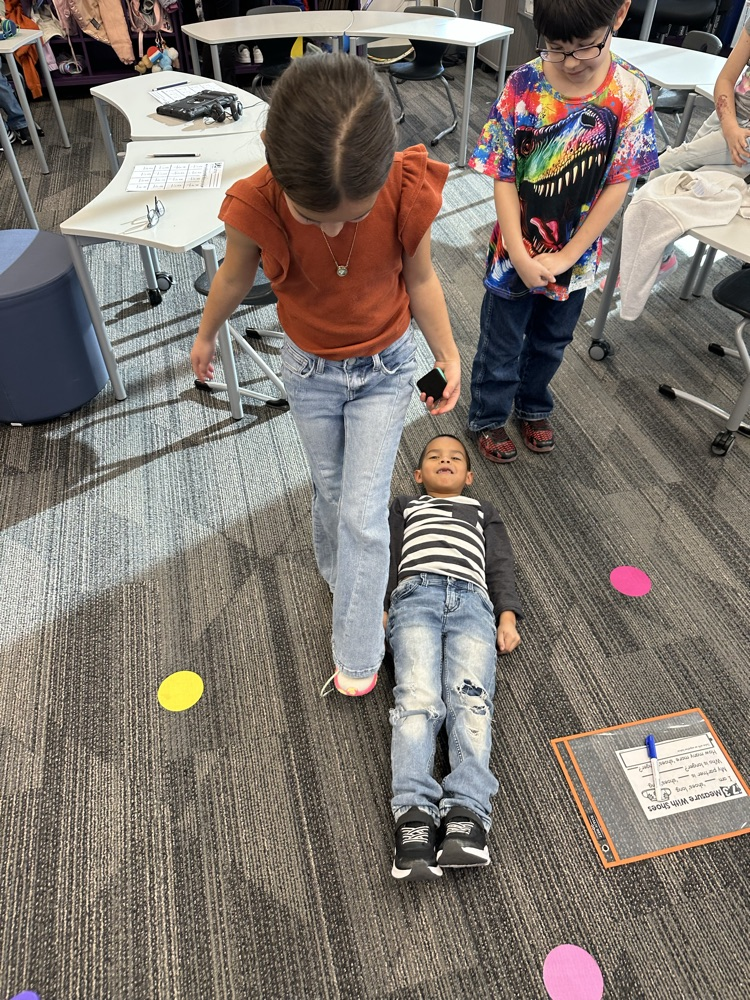 Measuring classmates using our feet