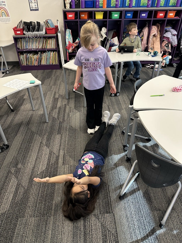 Measuring classmates using our feet.