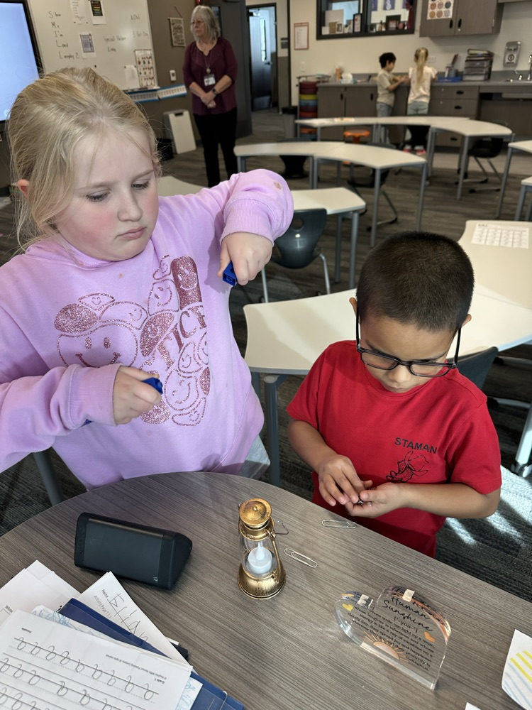 Measuring objects in the classroom using paper clips and blocks
