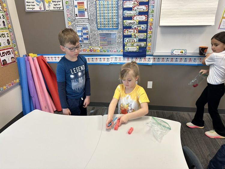 Measuring objects in the classroom using paper clips and blocks