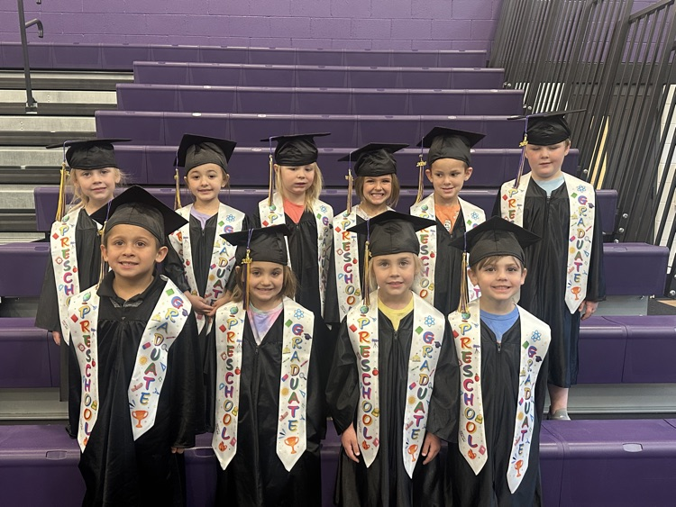 preschool graduates in caps and gown