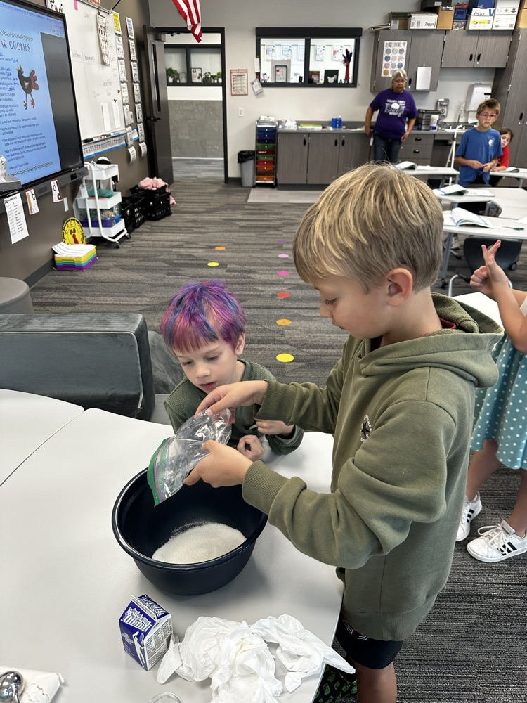 Adding ingredients to make cookies.