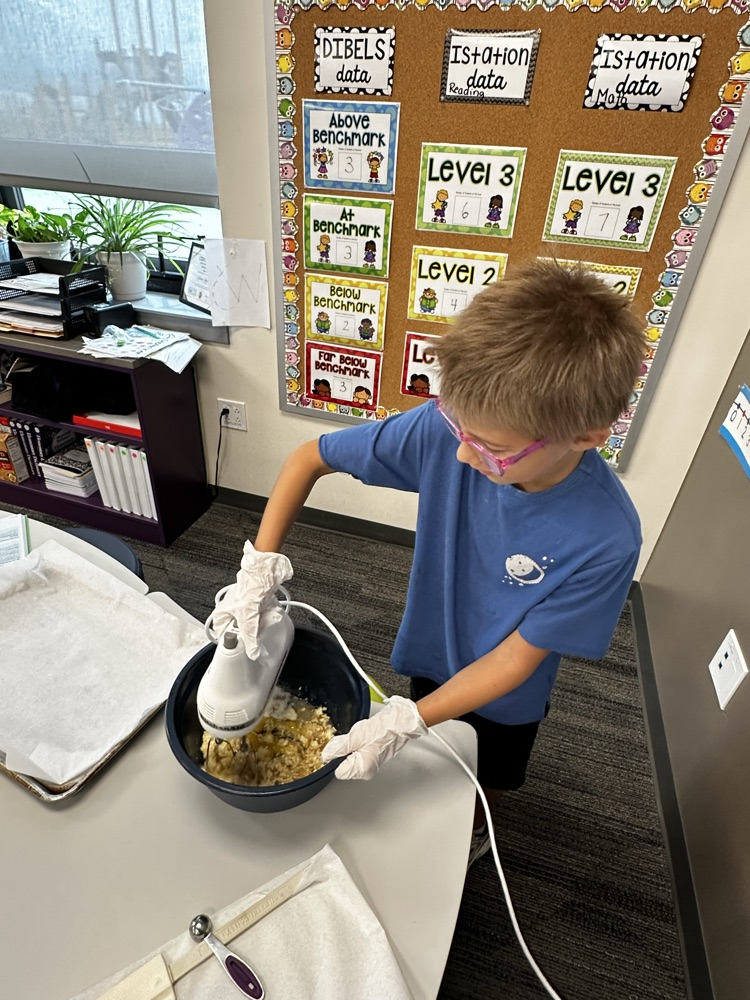 Adding ingredients to make cookies.