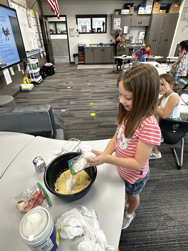 Adding ingredients to make cookies.