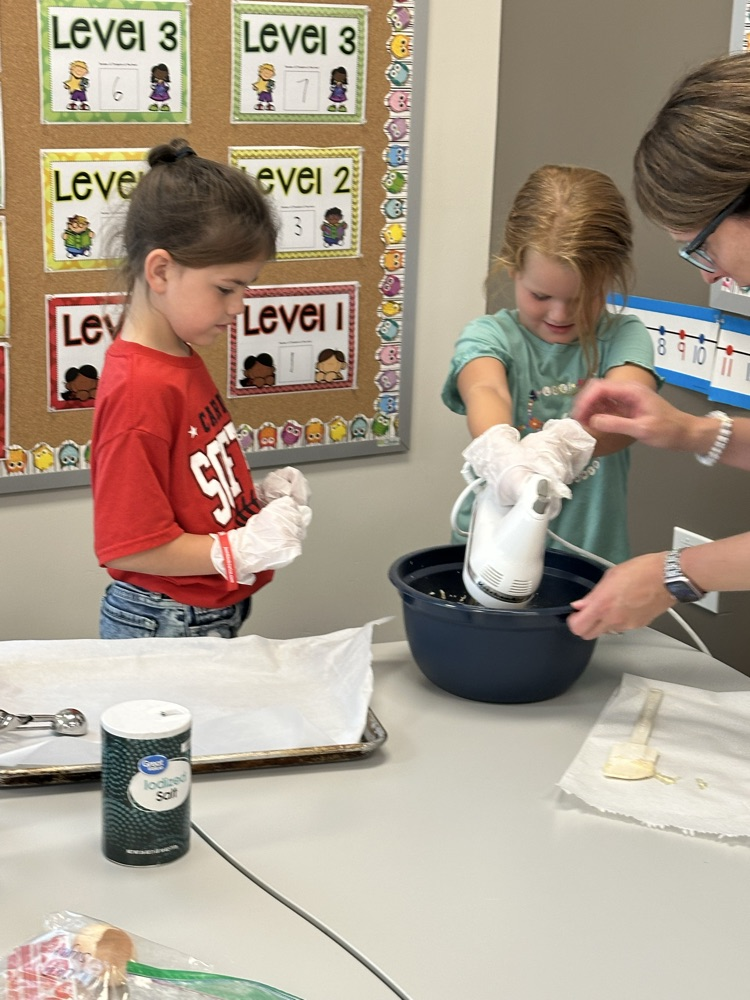 Adding ingredients to make cookies.